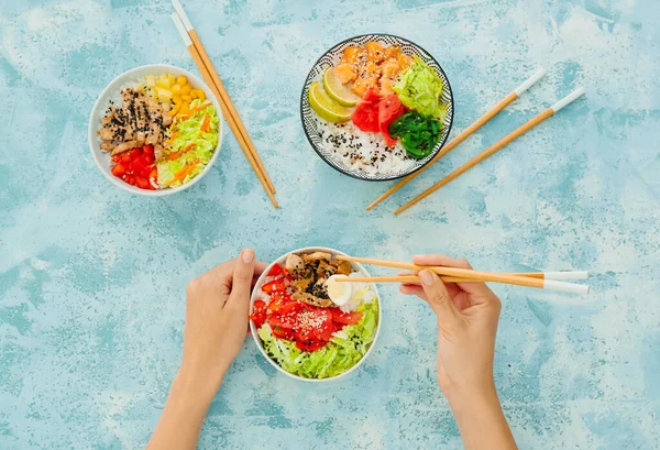 Woman Eating Tasty Rice Poke Bowl Color Background — Stock Photo, Image