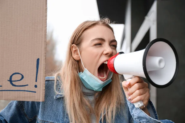 Protesting young woman outdoors. Impeachment concept