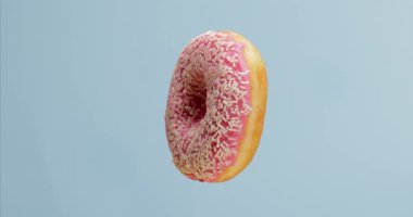 Renk arkaplanında lezzetli döner donut