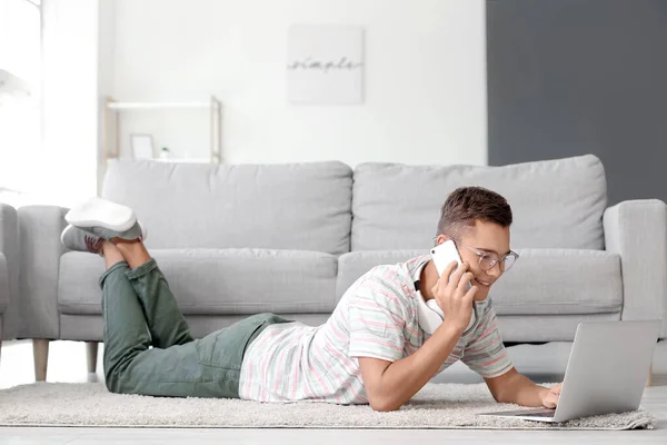 Teenage Boy Laptop Talking Mobile Phone Home — Stock Photo, Image