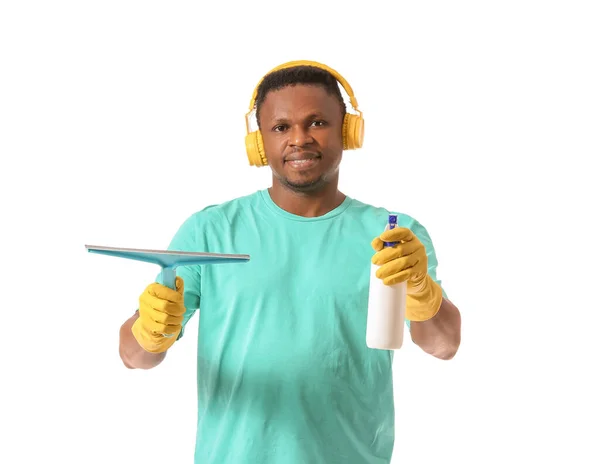 African American Man Cleaning Supplies Listening Music White Background — Stock Photo, Image