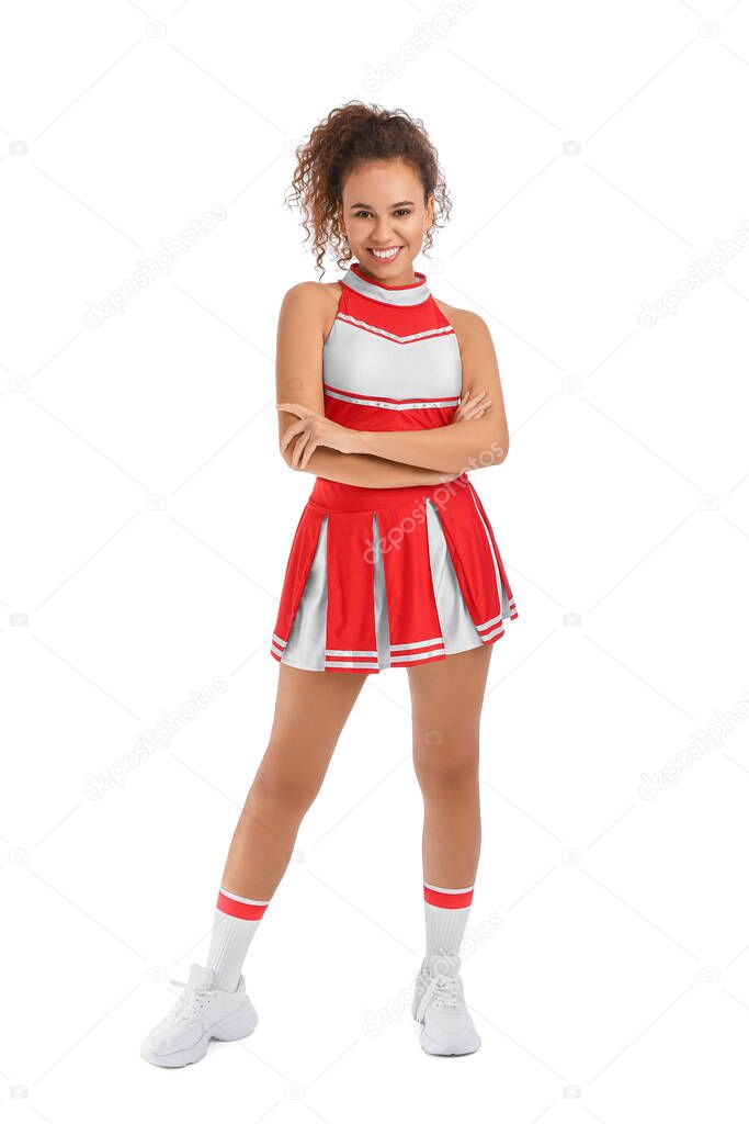 Beautiful young cheerleader on white background