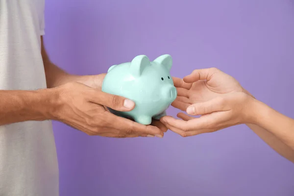 Hands Family Piggy Bank Color Background — Stock Photo, Image