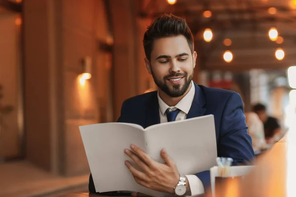 Young Businessman Reading Magazine Cafe — Stock Photo, Image