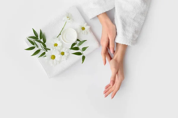 Female Hands Cream Towel Beautiful Flowers Light Background — Stock Photo, Image