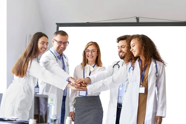 Team Doctors Putting Hands Together Meeting Modern Clinic — Stock Photo, Image