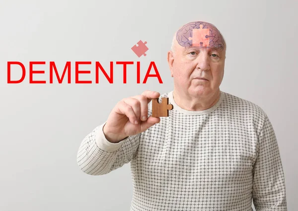 Elderly Man Suffering Mental Disability Puzzle Piece Grey Background — Stock Photo, Image