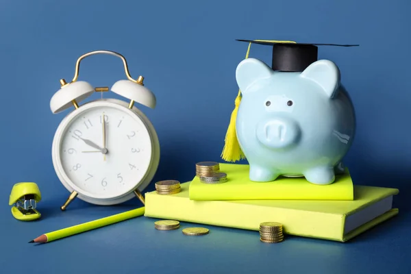 Piggy Bank Graduation Hat Coins Stationery Alarm Clock Color Background — Stock Photo, Image