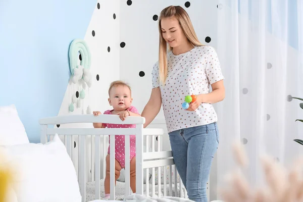 Happy Mother Cute Baby Standing Crib Home — Stock Photo, Image