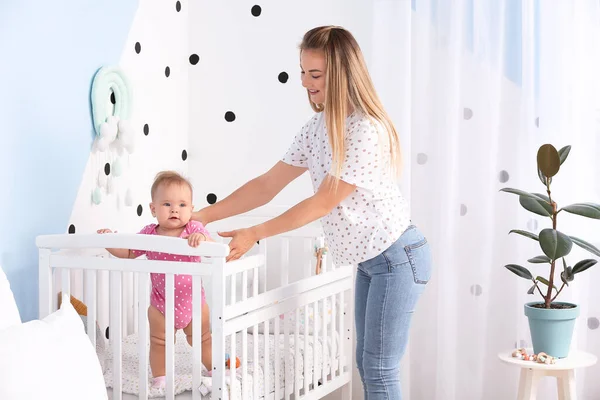 Mother Cute Baby Standing Crib Home — Stock Photo, Image