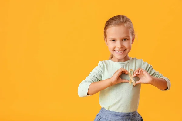 Little Girl Golden Ribbon Color Background Childhood Cancer Awareness Concept — Stock Photo, Image