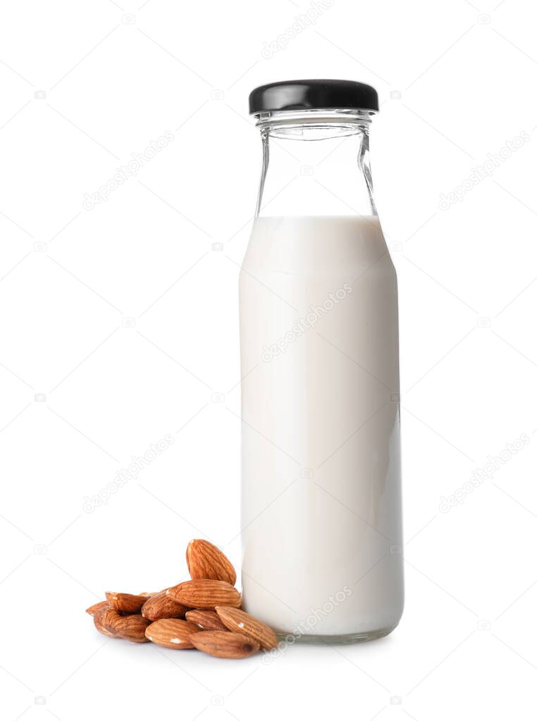 Bottle of almond milk on white background