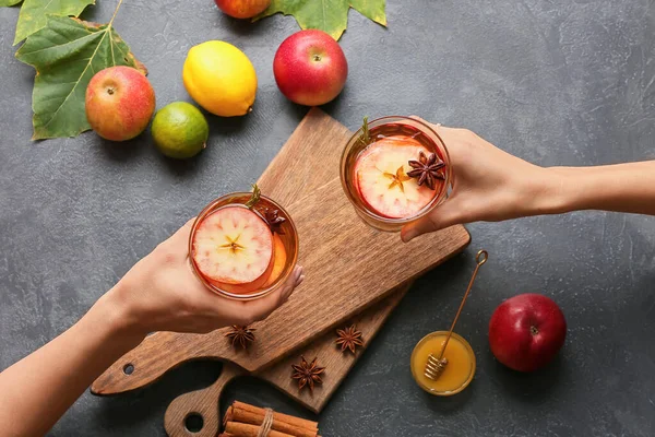 Women Holding Tasty Drinks Spices Apple Slices Glasses Dark Background — Stock Photo, Image