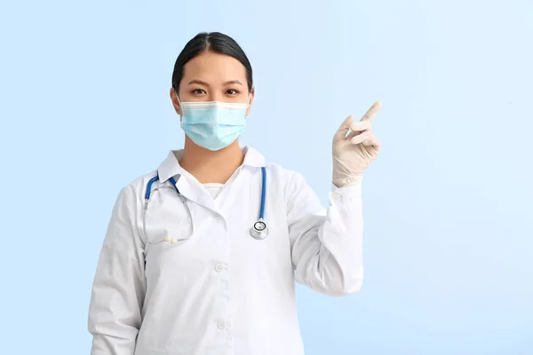 Portrait Female Asian Doctor Pointing Something Color Background — Stock Photo, Image