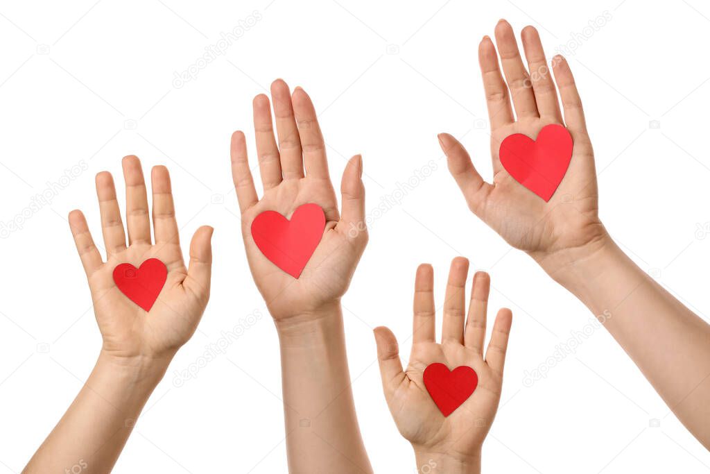 Hands with red hearts on white background