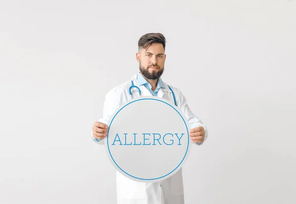 Portrait Male Doctor Holding Poster Text Allergy Light Background — Stock Photo, Image