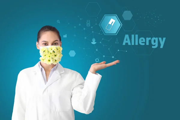 Portrait of female doctor in protective mask with flowers using virtual screen on color background. Concept of allergy