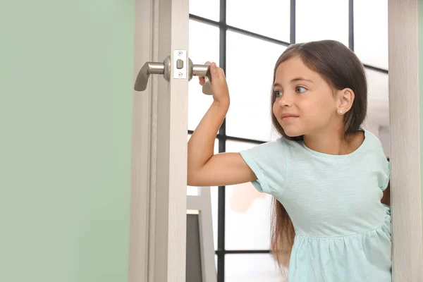 Cute Little Girl Looking Out Door — Stock Photo, Image