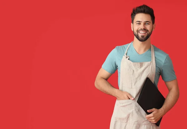 Young Man Holding Menu Color Background — Stock Photo, Image