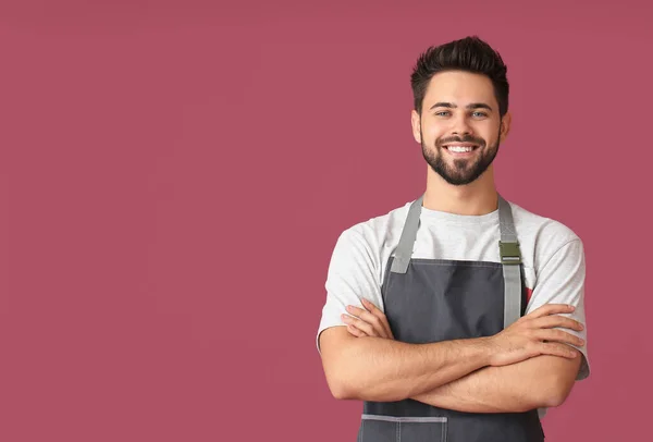 Young Man Wearing Apron Color Background — Stock Photo, Image