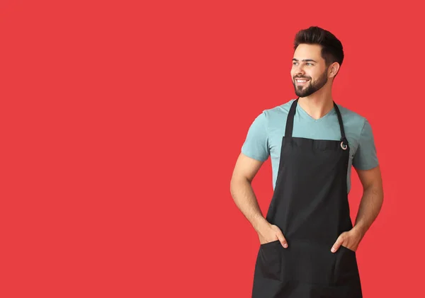 Young Man Wearing Apron Color Background — Stock Photo, Image