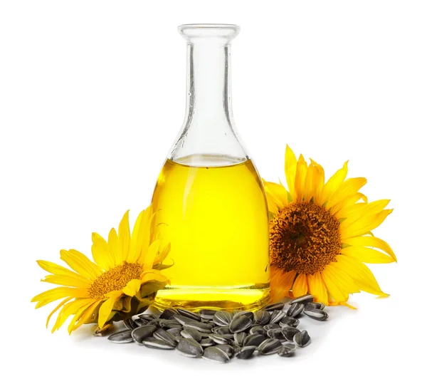 白色背景的油瓶 种子和向日葵 — 图库照片