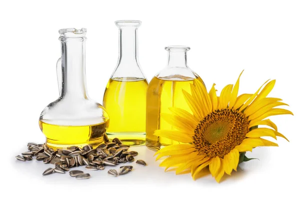 Flaschen Samen Und Sonnenblumen Auf Weißem Hintergrund — Stockfoto