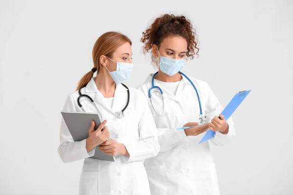 Portrait Female Doctors Wearing Medical Masks Light Background — Stock Photo, Image