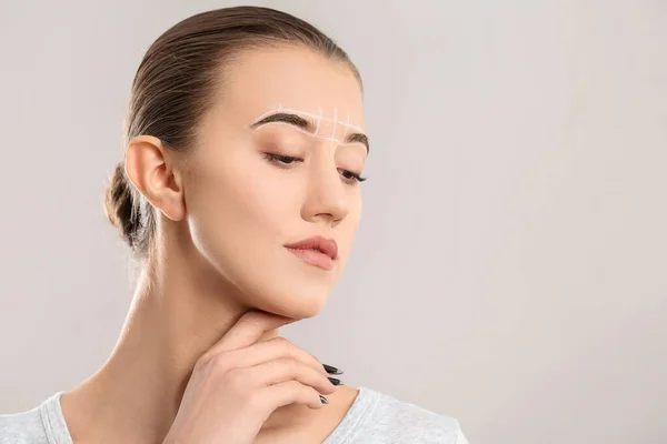 Beautiful Young Woman Marking Eyebrows Correction Grey Background — Stock Photo, Image