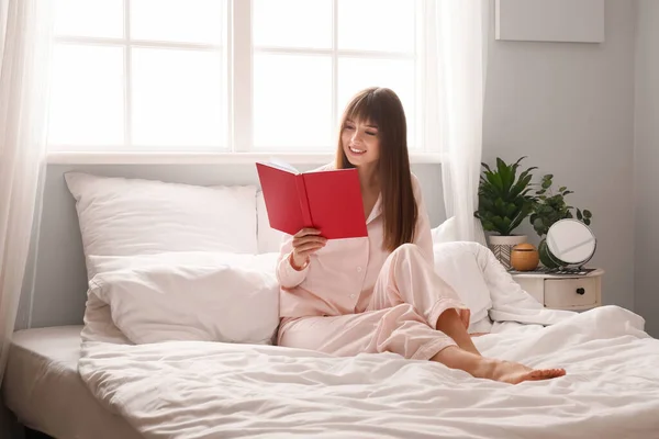 Beautiful Young Woman Reading Book Bedroom — Stock Photo, Image