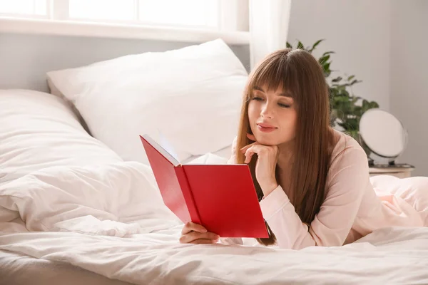 Beautiful Young Woman Reading Book Bedroom — Stock Photo, Image