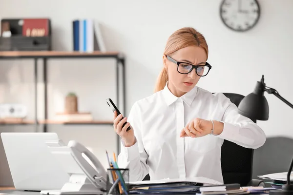 Woman trying to meet deadline in office