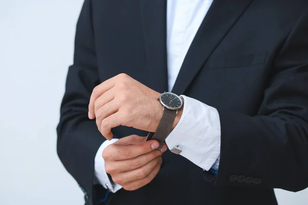 Young Businessman Wearing Stylish Wristwatch Light Background — Stock Photo, Image
