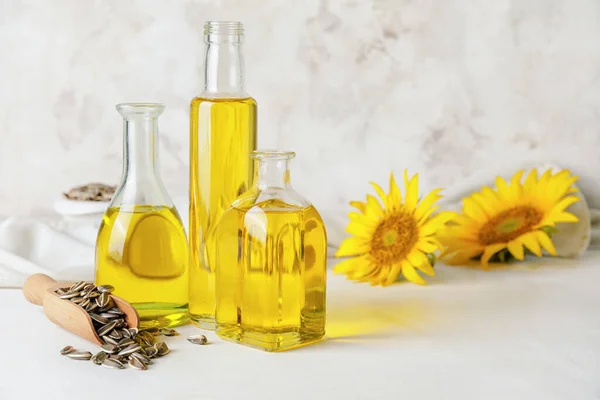 Bottles Oil Scoop Seeds Sunflowers Light Background — Stock Photo, Image