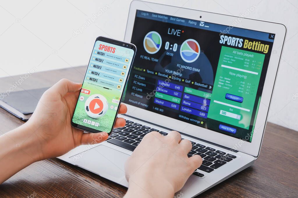 Man placing sports bet at home