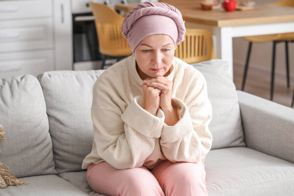 Sad mature woman after chemotherapy at home