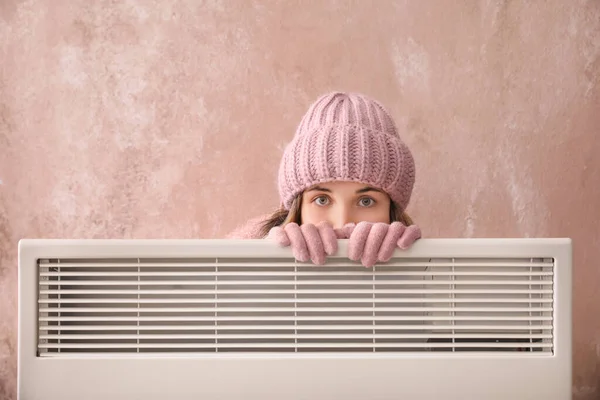 Young Woman Warm Clothes Electric Heater Color Background Concept Heating — Stock Photo, Image