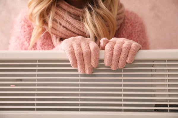 Young Woman Warm Gloves Electric Heater Closeup Concept Heating Season — Stock Photo, Image