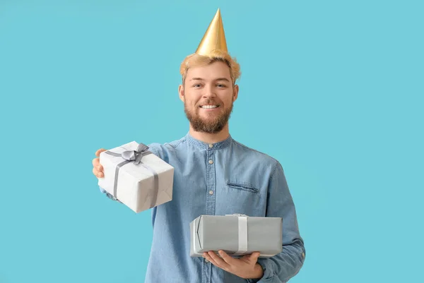 Young Man Celebrating Birthday Color Background — Stock Photo, Image