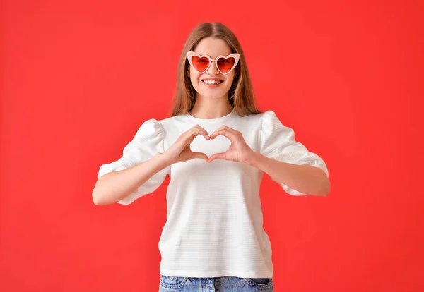 Young Woman Making Heart Her Hands Color Background — Stock Photo, Image