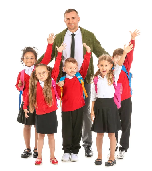 Männlicher Lehrer Und Kleine Schüler Mit Erhobenen Händen Auf Weißem — Stockfoto