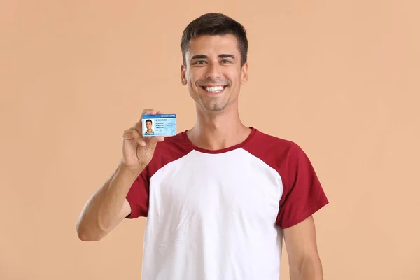 Happy Young Man Driving License Color Background — Stock Photo, Image