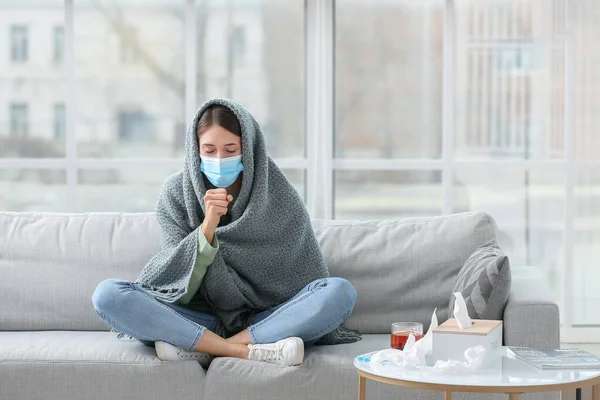 Sick Young Woman Medical Mask Sitting Sofa Home — Stock Photo, Image