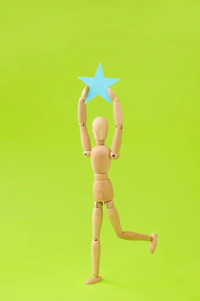 Wooden Mannequin Star Color Background — Stock Photo, Image