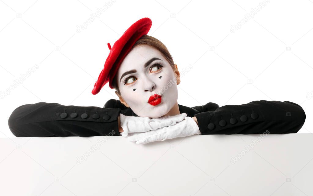 Female pantomimist with blank poster on white background