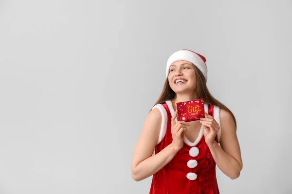 Young Woman Santa Claus Costume Gift Card Grey Background — Stock Photo, Image