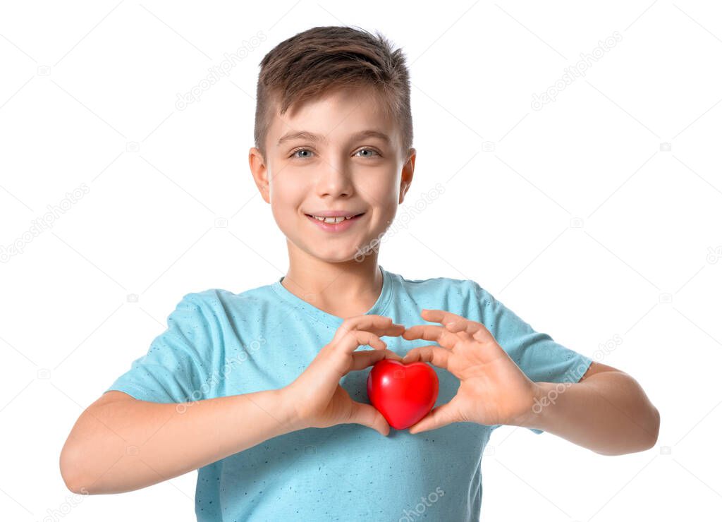 Cute little boy with red heart on white background