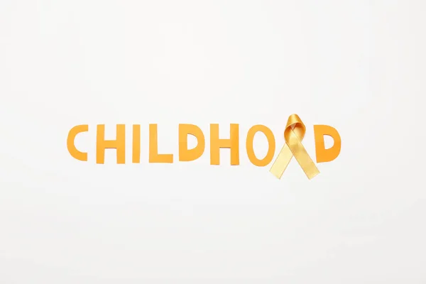 Golden Ribbon Word Childhood White Background Cancer Awareness Concept — Stock Photo, Image