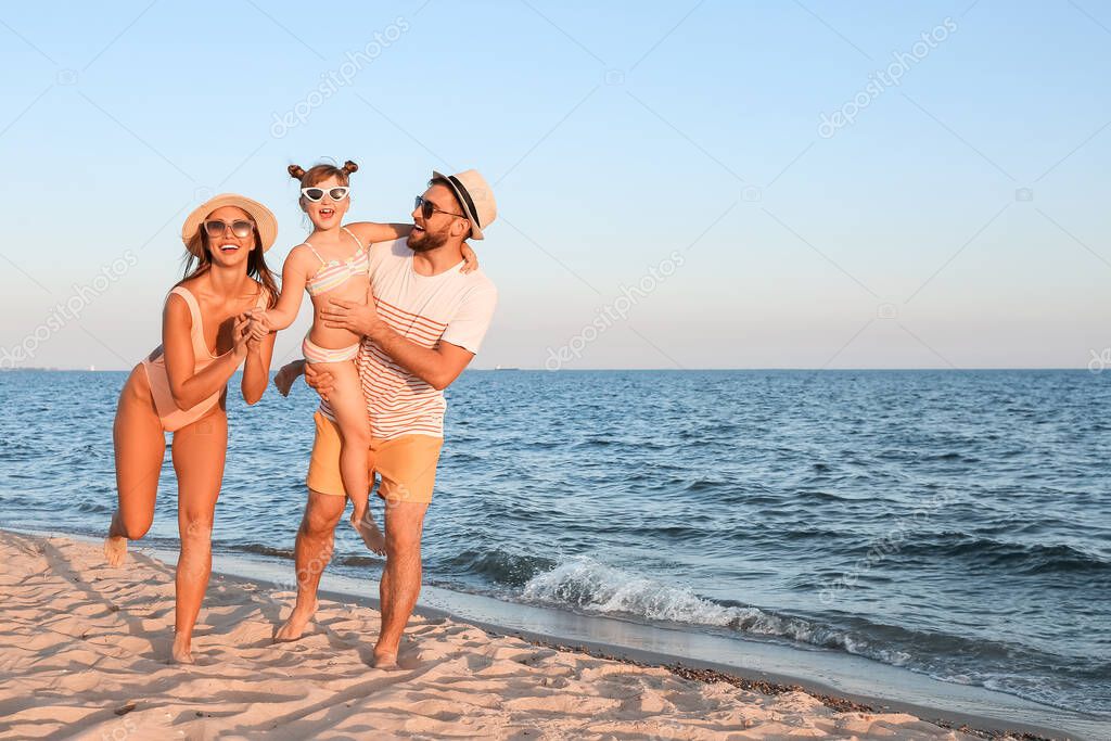 Happy family on sea beach