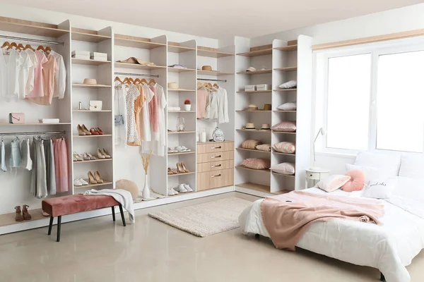 Interior of white modern bedroom with wardrobe